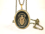 Scarab Beetle Pill Box Locket Inlaid in Hand Painted Glossy Black Enamel Burnished Gold Locket Egyptian Necklace w Personalized and Colors
