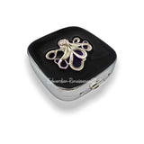 Silver Octopus inlaid in hand painted black enamel pill box.